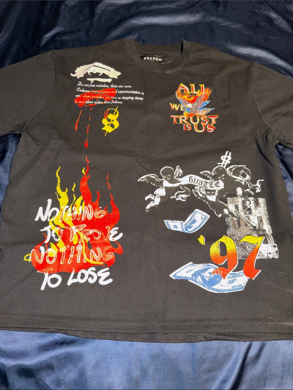 Reason Black Short Sleeve Tee with Multicolor Graphic Designs And Pictures